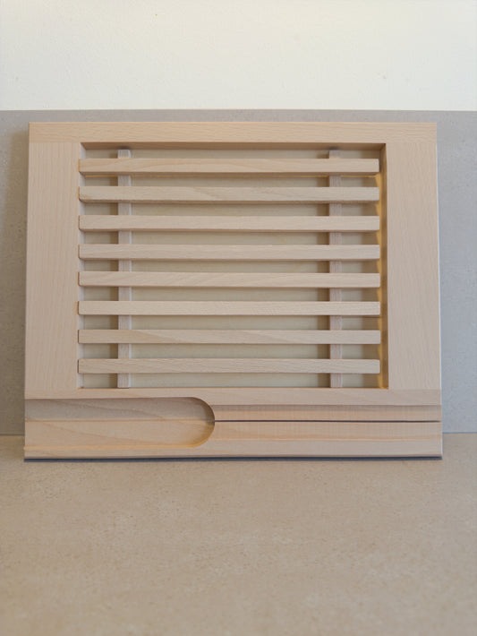 Bread cutting board with crumb catcher and knife holder