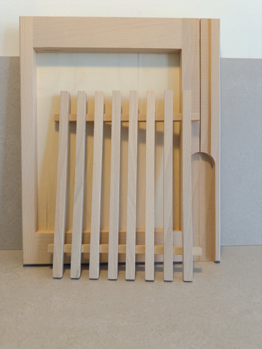 Bread cutting board with crumb catcher and knife holder